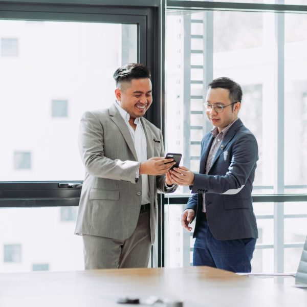 Business men in suits collaborating on marketing work