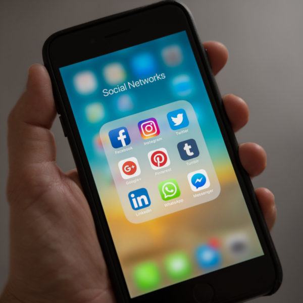 Social media apps pulled up on an iPhone
