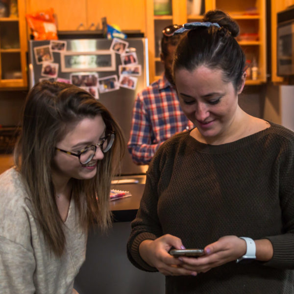 Remote social media managers looking at their social achievements