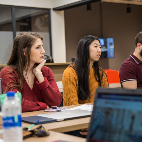 Remote team members working together in person