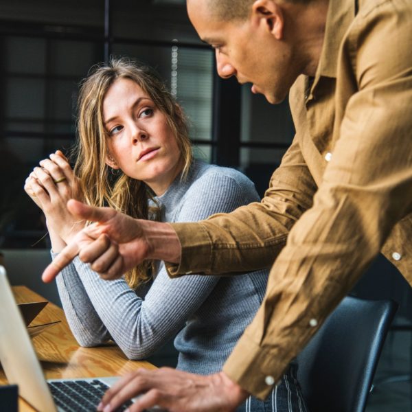 Man and woman discussing marketing plans