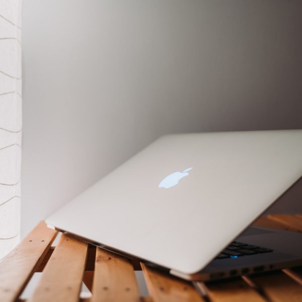 Laptop on a desk at a coffee shop