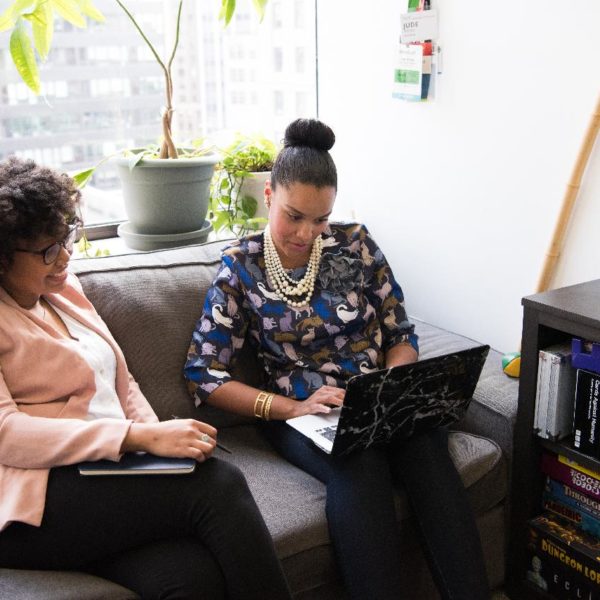 Business woman communicating with her client in person