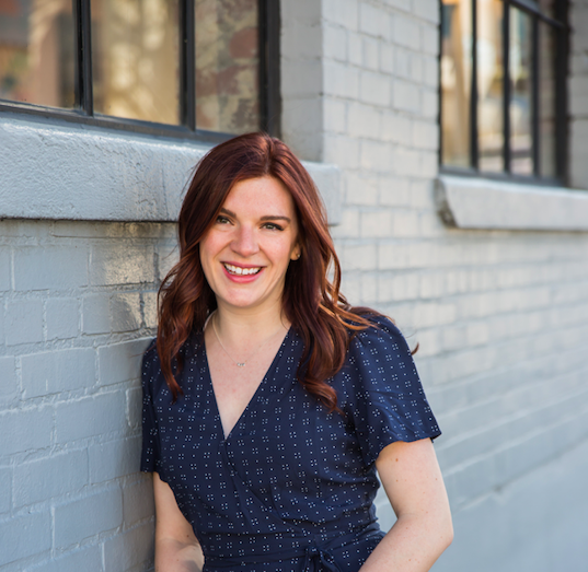 Piccolo CEO, Anna-Vija McClain smiling in front of a building