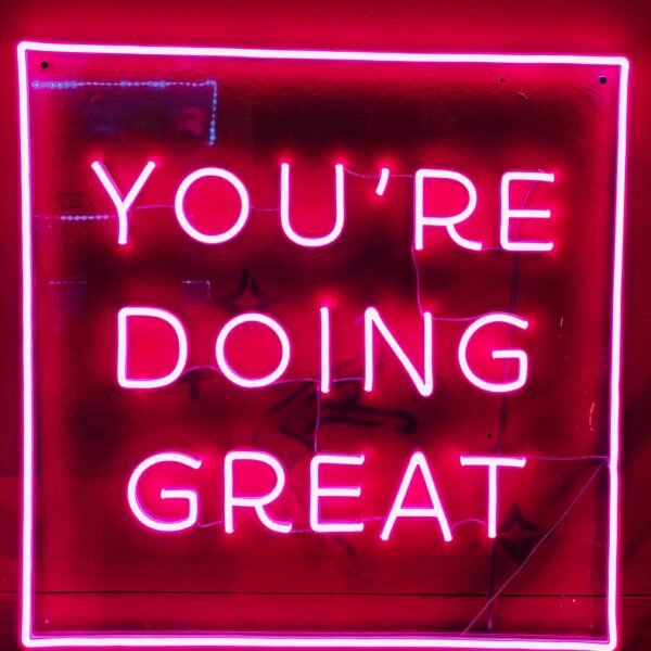 "You're doing great" neon pink sign