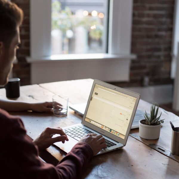 Small business worker working from home on his laptop